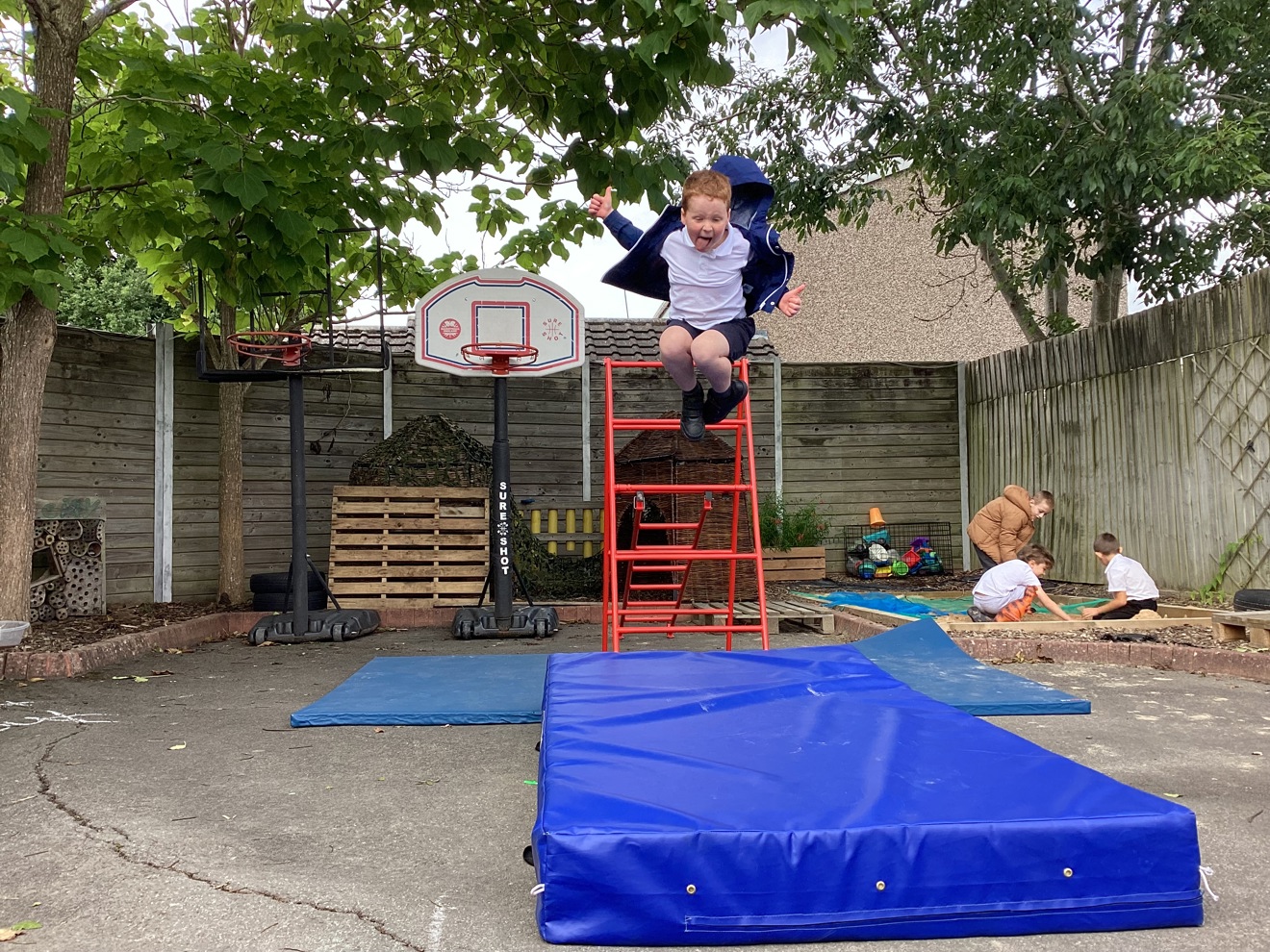 Beacon PRU child jumping onto crash mat